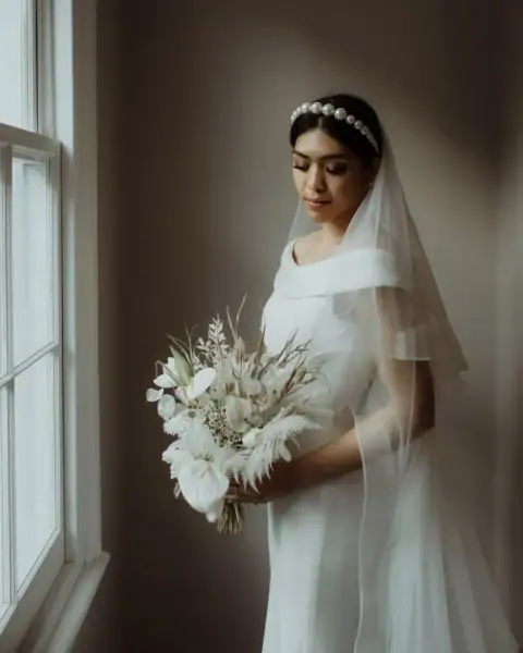Bride with wedding flowers on her elopement day taken by Orsi from The Soulbounders