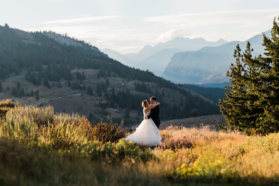 A bride and groom enjoy the sunset after their North Cascades elopement photographed by Amy Galbraith