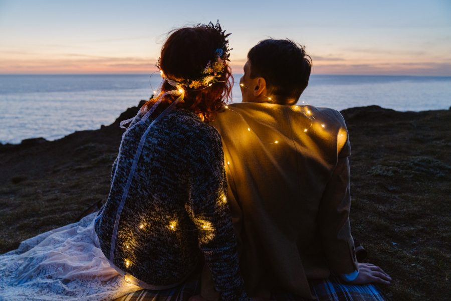 Outshined Photography loves photographing couples watching the sun set over the ocean