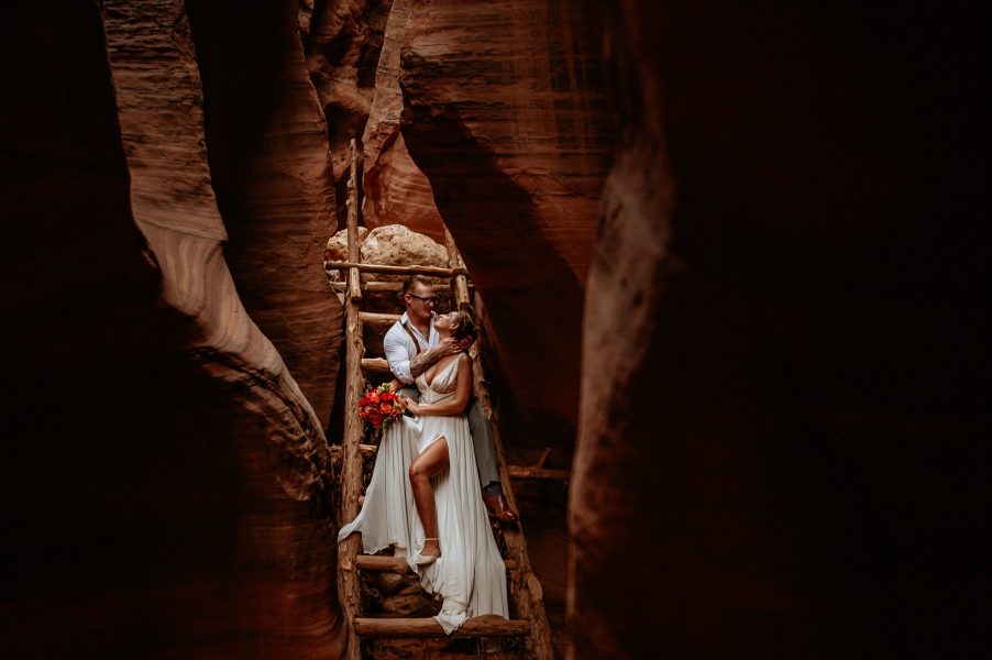romantic embrace inside a slot canyon during a southern Utah elopement
