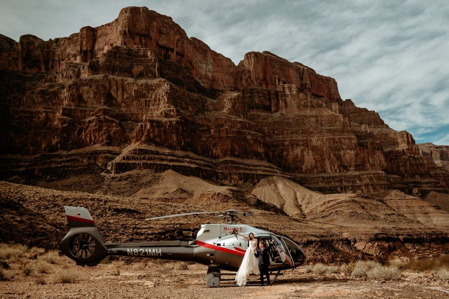 Wedding couple celebrates their elopement in the Grand Canyon with a helicopter