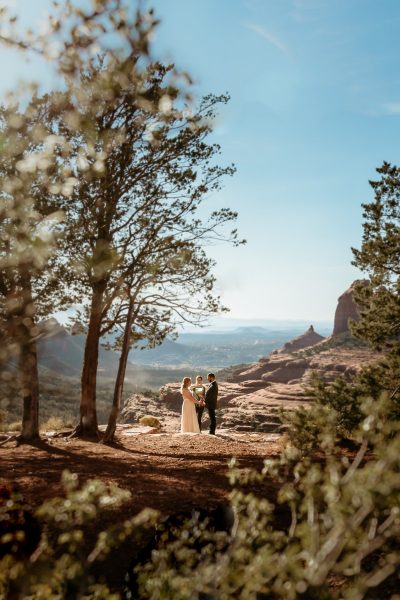 Couple during their elopement sage ceremony overlooking Sedona AZ