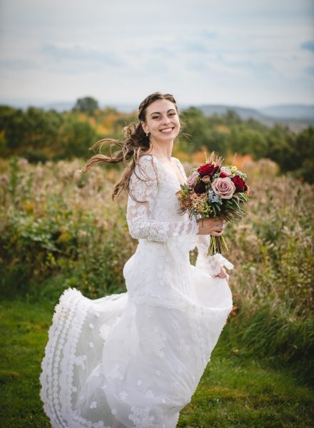 bride twirling in meadow