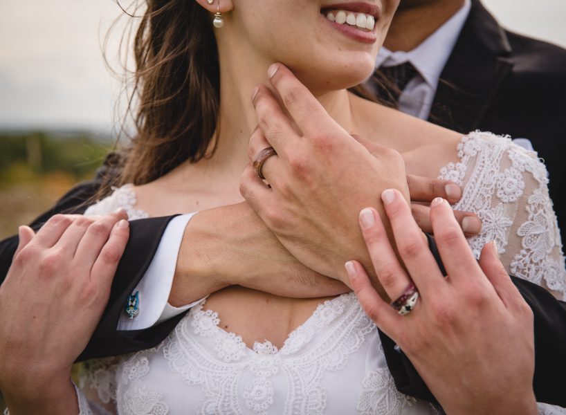 close up of bride and groom's hands