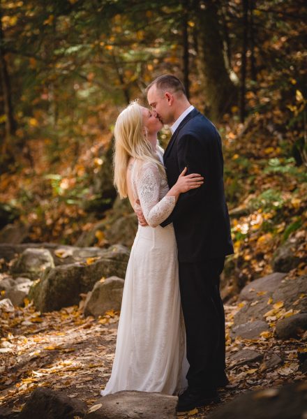 couple kissing in the woods during their New Hampshire Elopement