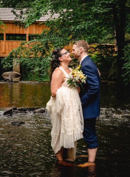 New England elopement couple in river