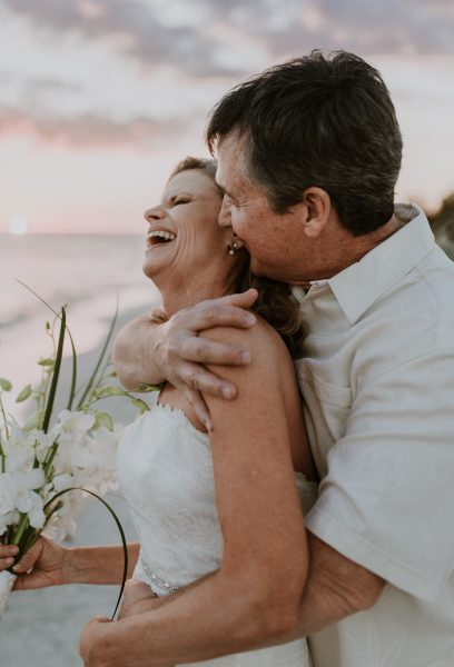 older couple embracing and laughing