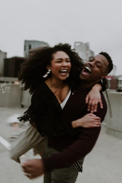 blurry black couple embracing in the city