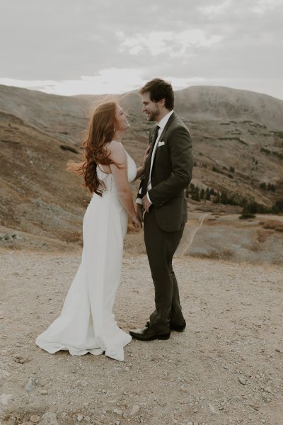 couple eloping at the top of a mountain
