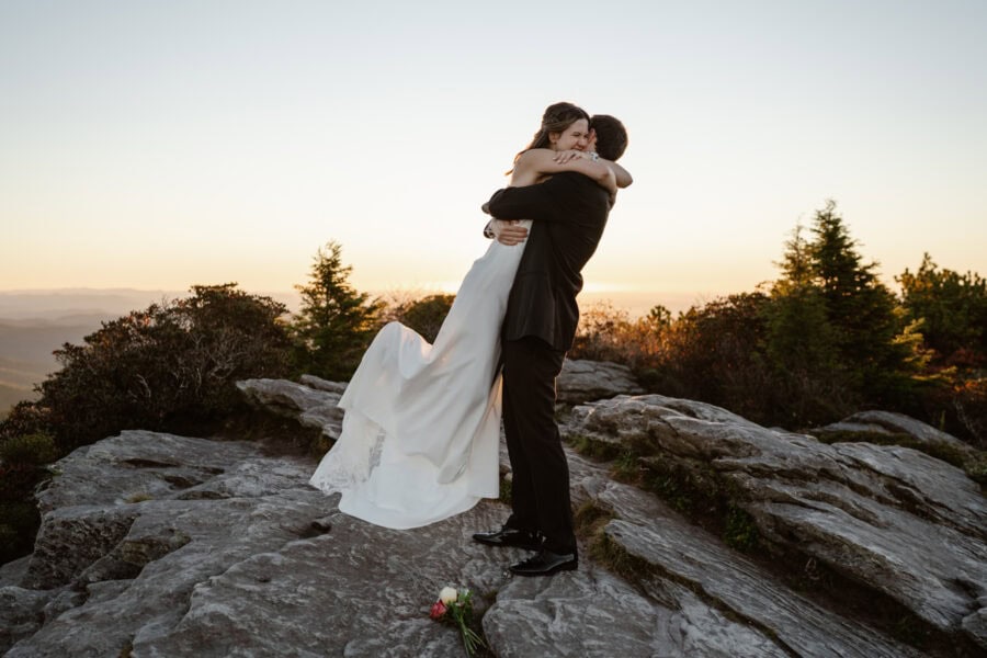A couple happily embracing after their first kiss during their elopement ceremony