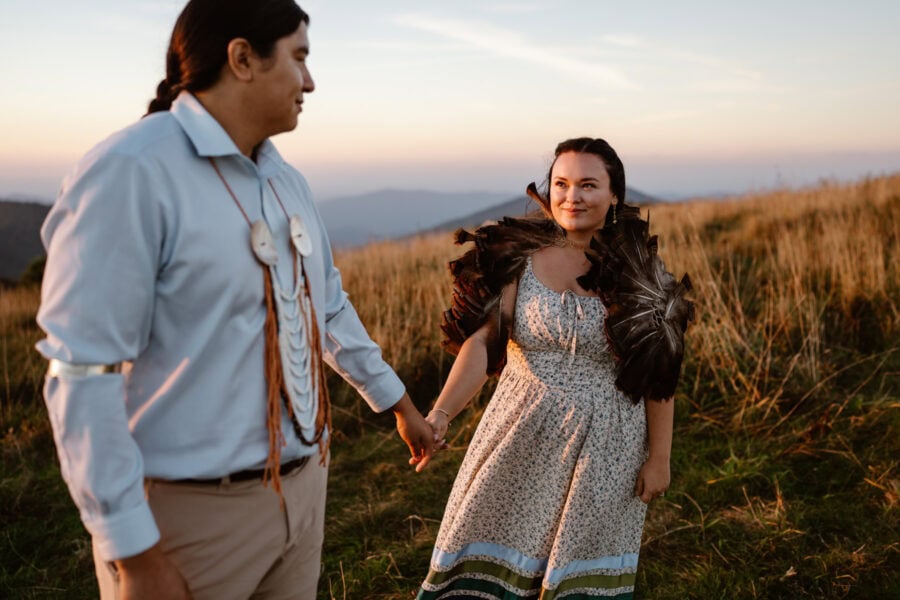 Native American couple walking together in the mountains near Asheville NC