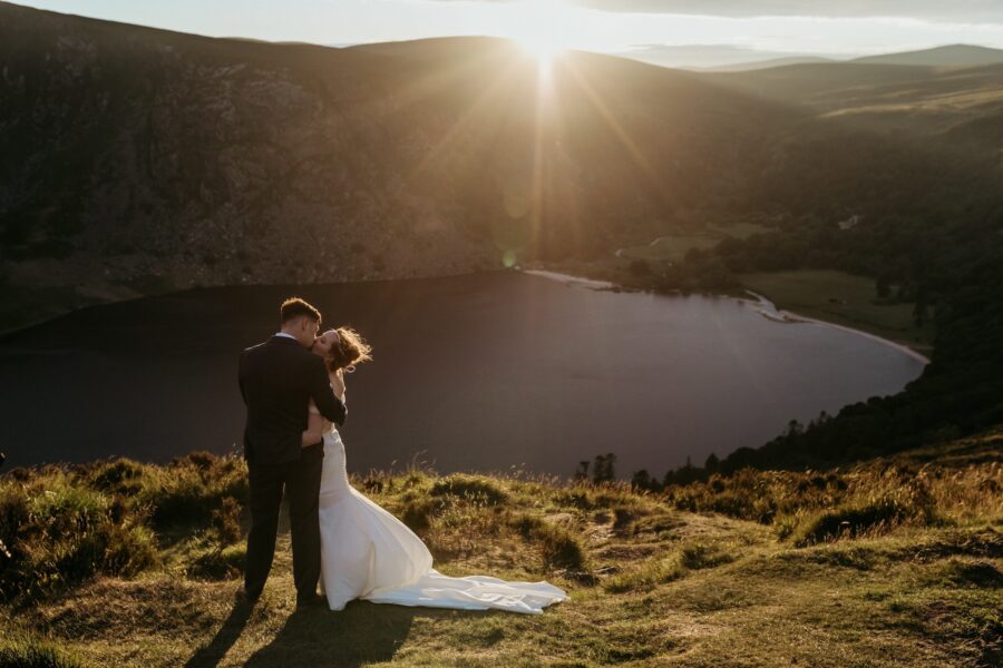 A bride and groom kiss at sunset after their elopement in Ireland.