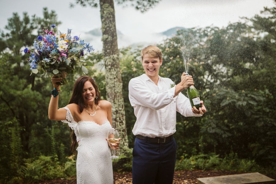 Bride & Groom popping champagne