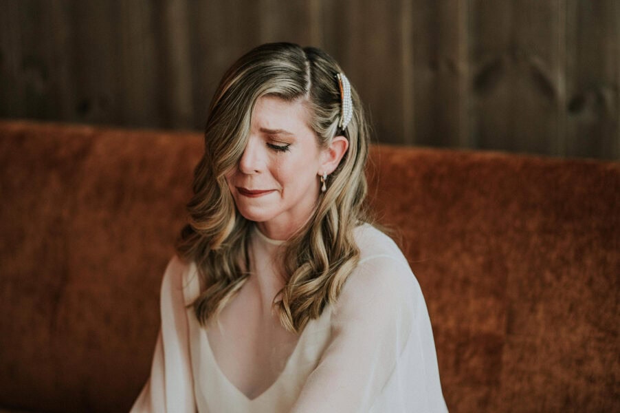 Beautiful bride crying on the day of her elopement