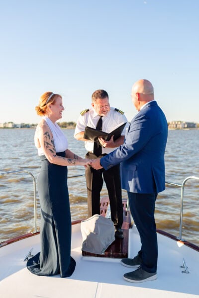 A bride and groom elope on a motoryacht in Seabrook Texas.