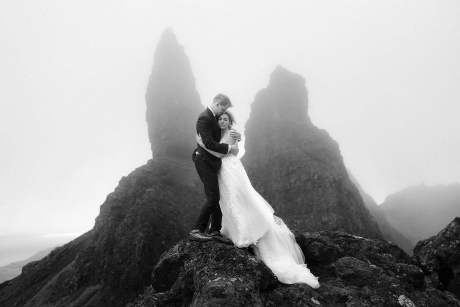 Bride and groom embrace on The Storr on the Isle of Skye