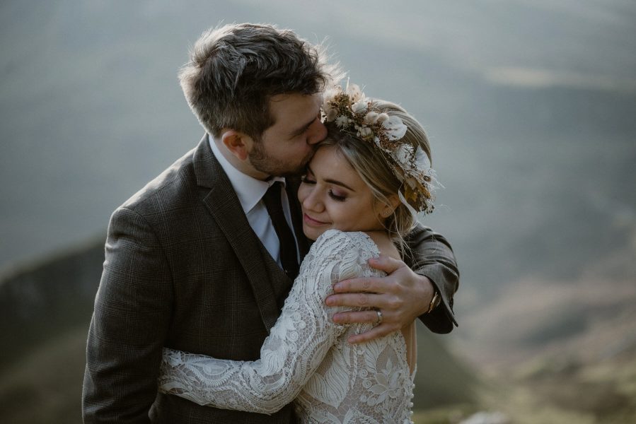 Bride and groom embrace after their wedding ceremony on the Isle of Skye in Scotland