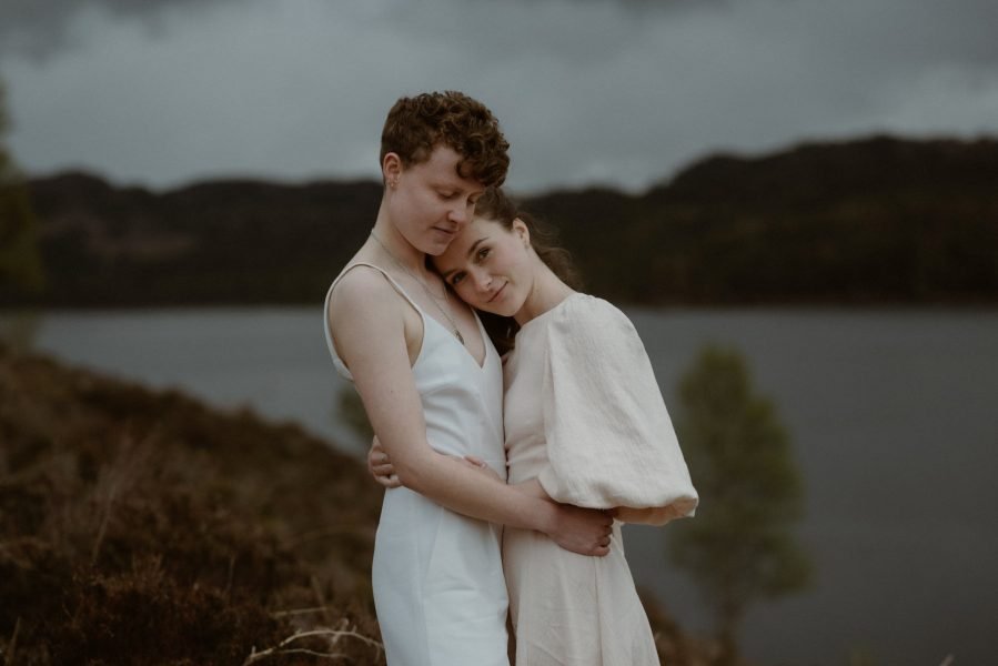 Two brides embrace at a Scottish elopement wedding