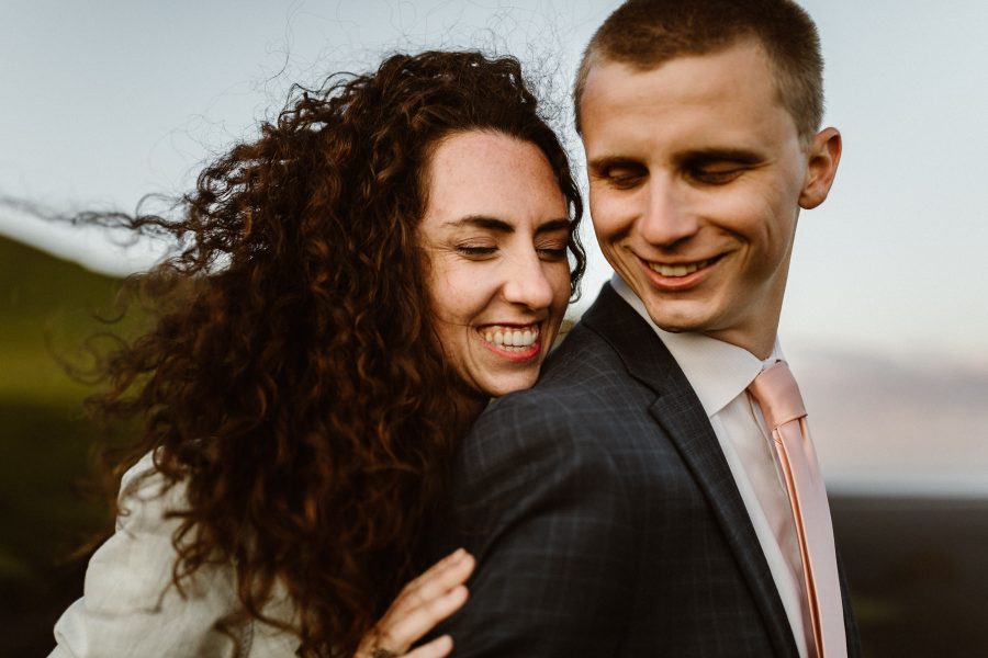 A newlywed couple snuggling in Iceland