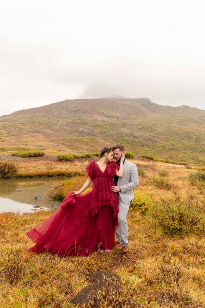 independence pass adventure session, bright red ruffle dress, grey suit, couple elopement
