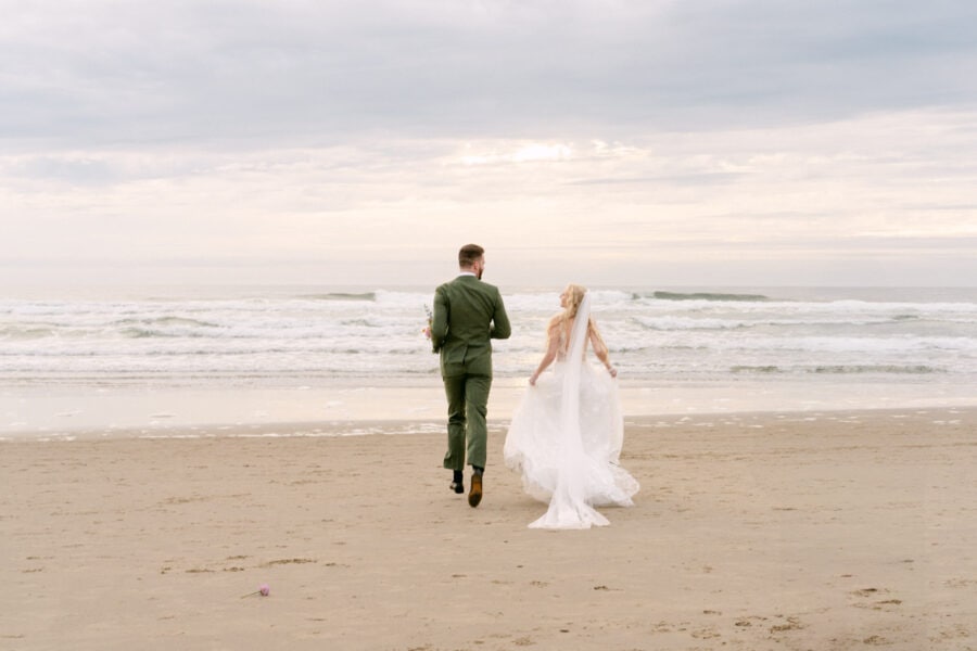 Romantic wedding couple on the sandy shores of Cannon Beach.