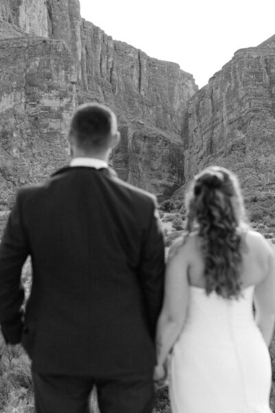 Bride and groom standing together in Santa Elena Canyon during their Big Bend National Park elopement, surrounded by dramatic canyon walls.