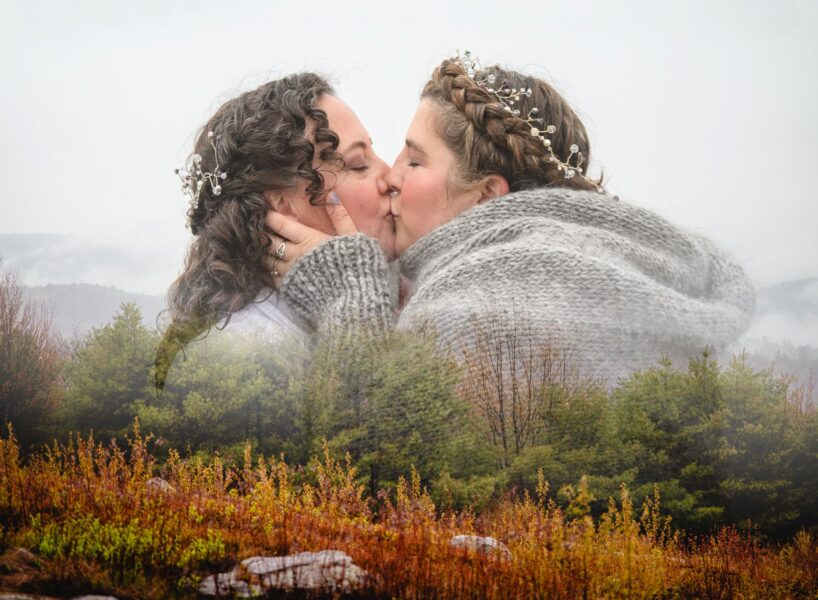 double exposure photo of two brides kissing with mountain landscape overlay