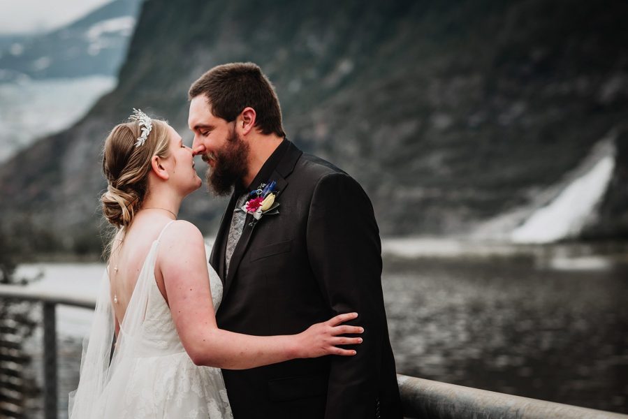 bride and groom in front of mendenhall glacier