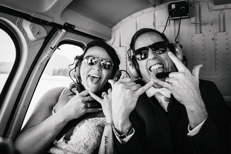 bride and groom with sunglasses during helicopter wedding