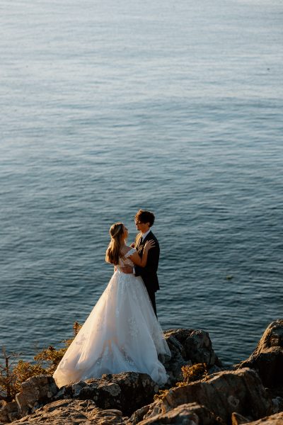 Couple getting married on coast of Maine