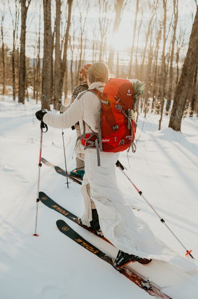 couple backcountry skiing for vermont winter elopement