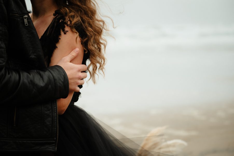 bride in black wedding dress eloping on the oregon coast