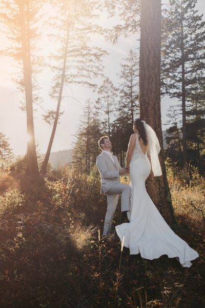 bride and groom in the forest at golden hour photographed by Photos by Pala Mikayla