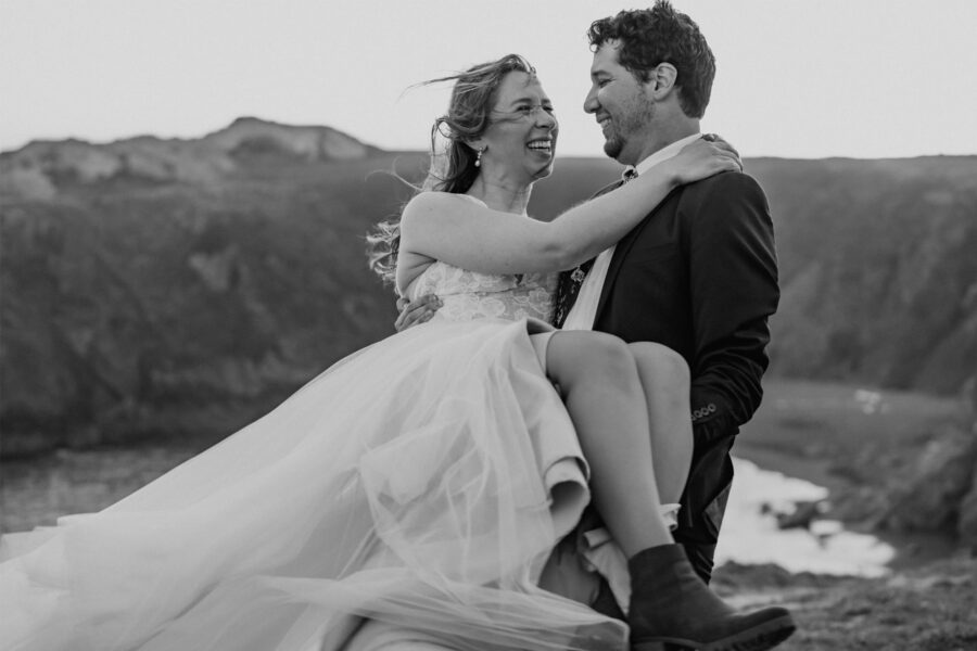 Couple at cliff during sunset for california beach elopement