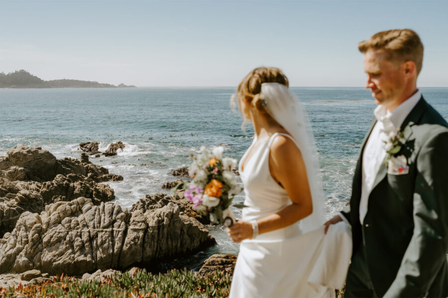 carmel beach elopement couple taking a walk