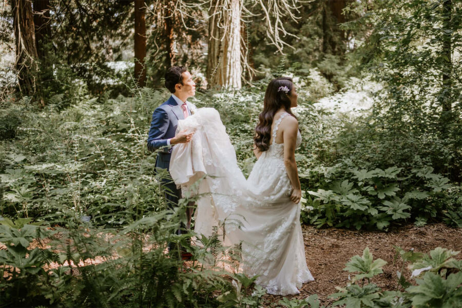 couple adventuring through redwoods in Big Sur for elopement