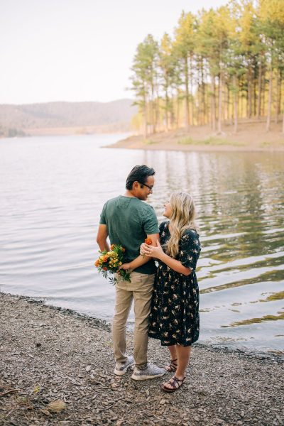 Couple embraces on the banks of Pactola in Black Hills National Forest