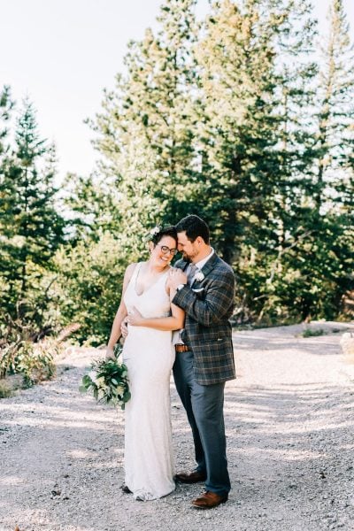 Couple embraces at elopement on top of Terry Peak in the Black Hills of SD