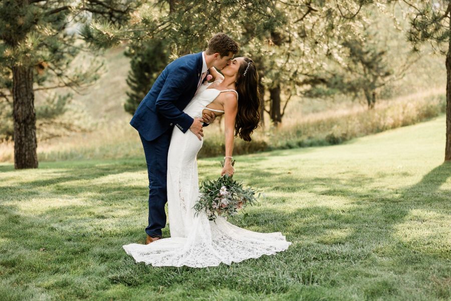 Couple kisses at intimate backyard wedding in Rapid City, South Dakota