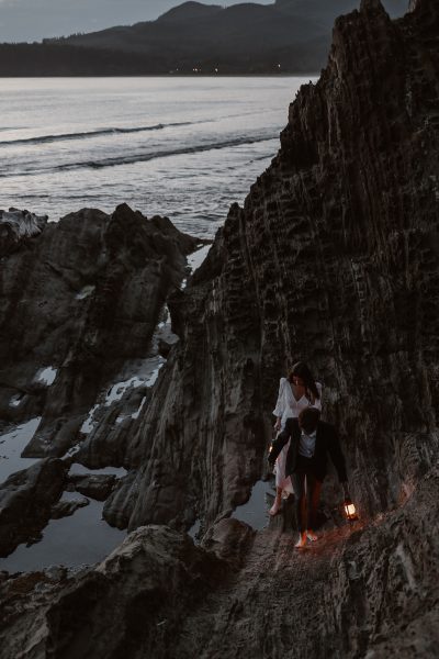 Couple hiking during blue hour with lantern for their Olympic National Park elopement