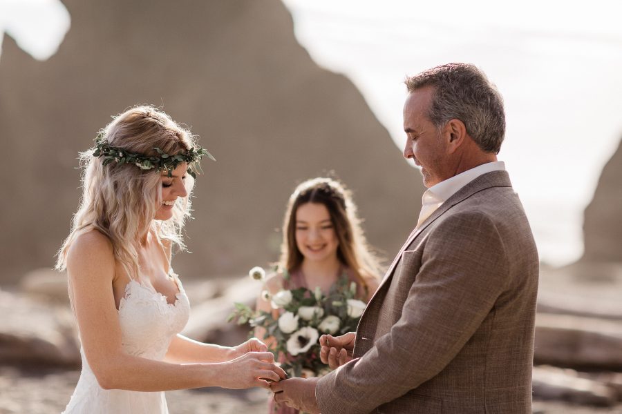 Couple saying vows on a sunny day at Ruby Beach