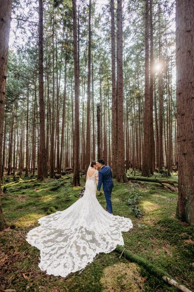 Newlywed portrait in the emerald green forest