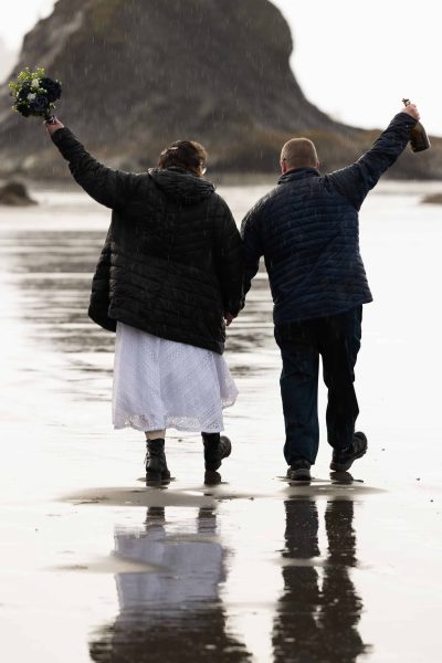 Couple celebrating at Olympic National Park second beach adventure elopement