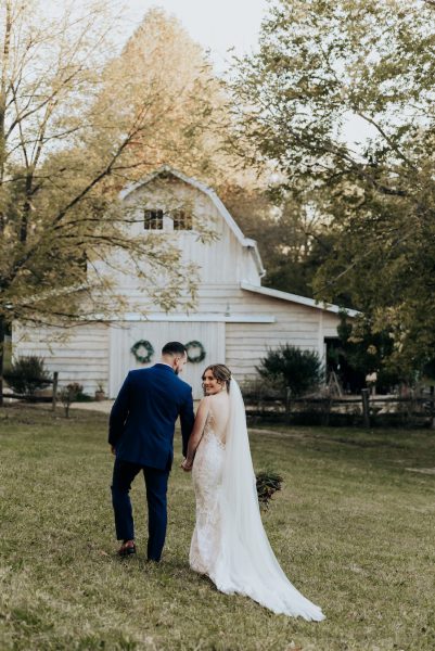 Bride and Groom walk to their wedding reception at the Side Porch Wedding Venue in the Tri Cities Tennessee