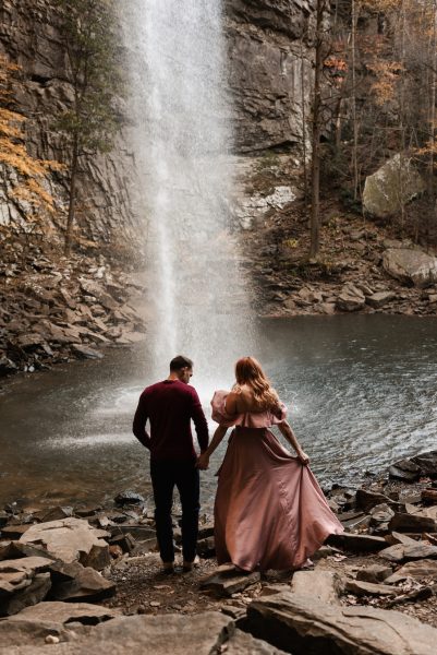 Newlywed couple poses overlooking Ozone Falls