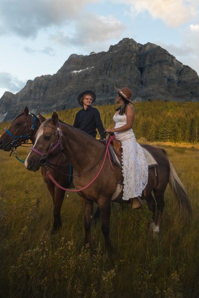 couple eloping on horses in Banff