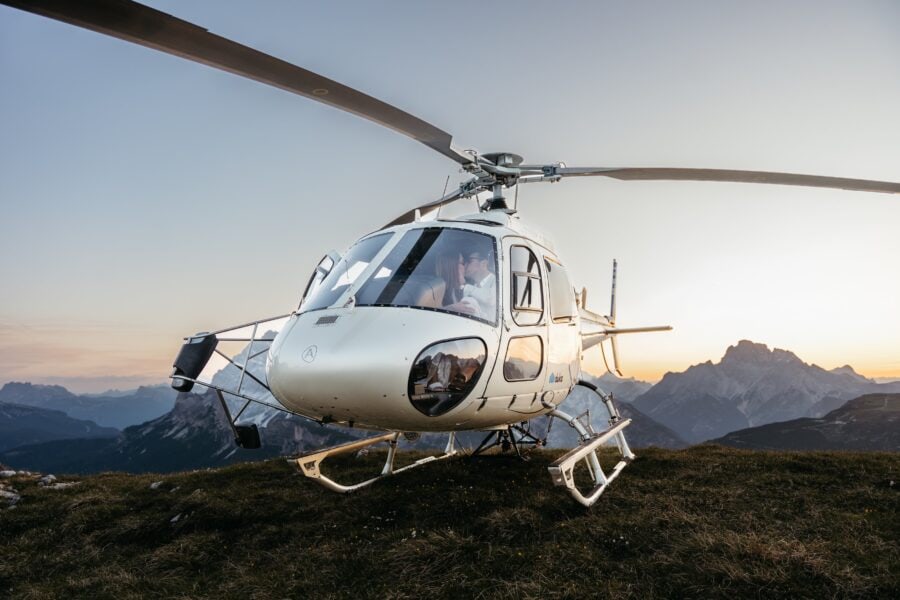 Couple eloping at Cadini di Misurina and Tre Cime with helicopter during sunset