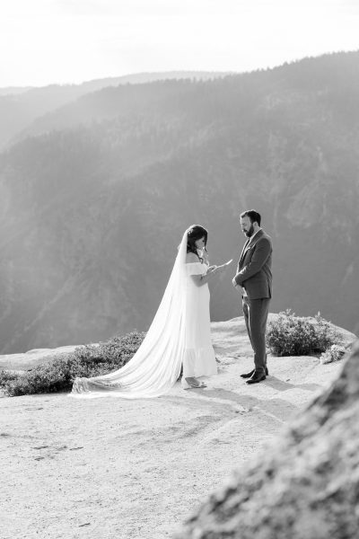Eloping Couple with Bride Reading Vows