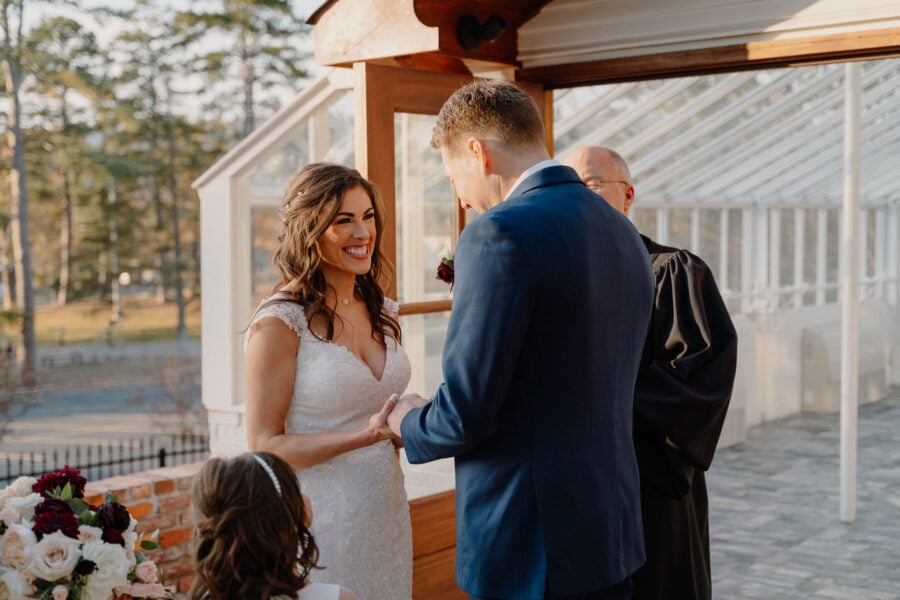 photo of bride and groom holding hands during their elopement ceremony