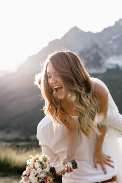 Groom lifting his bride up during sunset and golden hour at Alps Elopement in Austria
